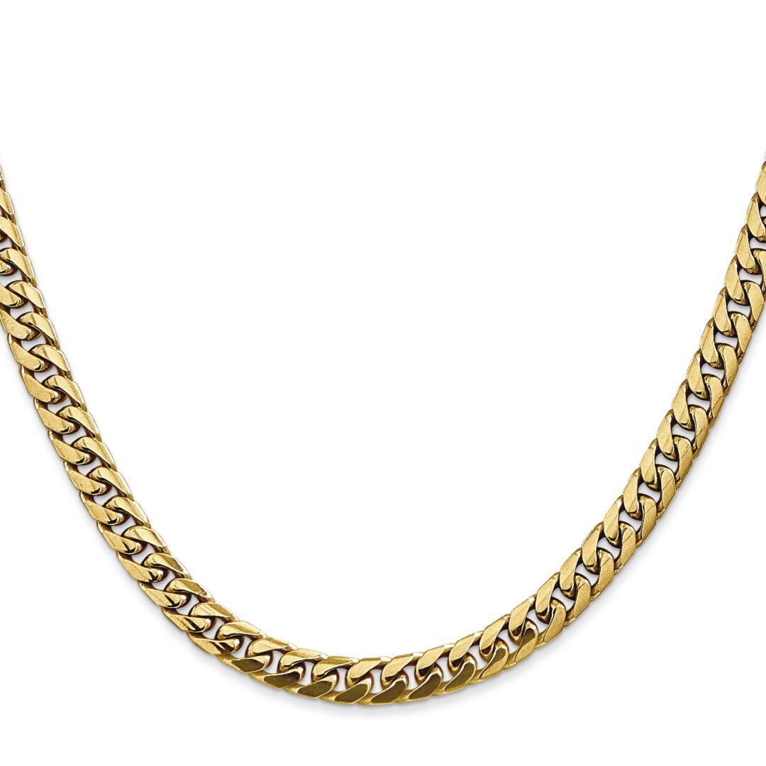 Gold chain necklace on white background.