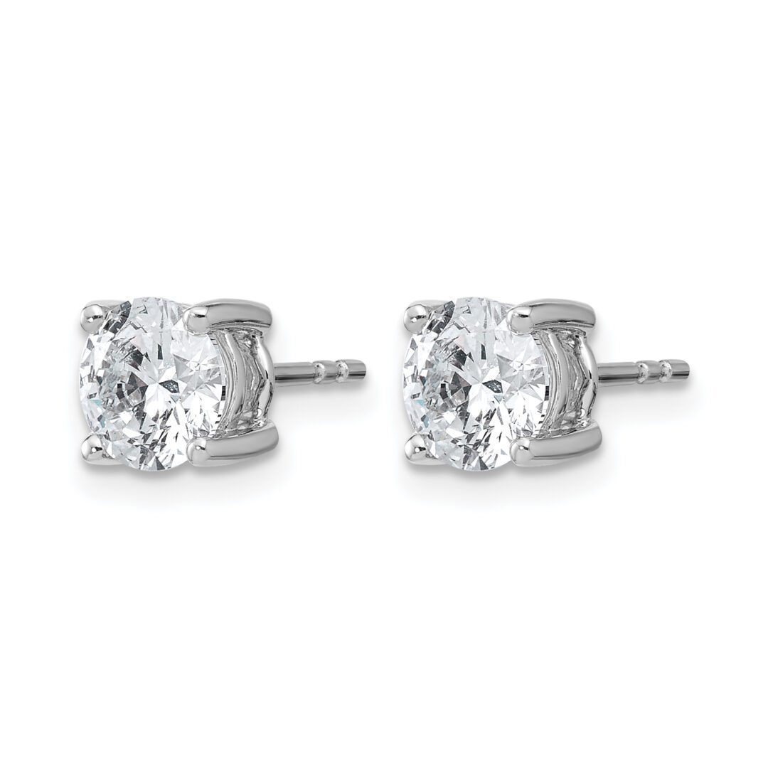 Diamond stud earrings with silver settings.