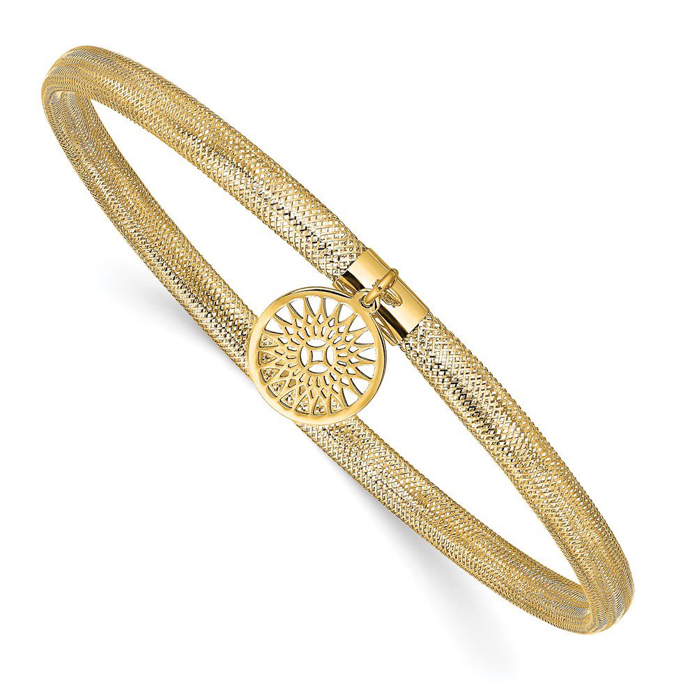 Gold bracelet with intricate circular design.