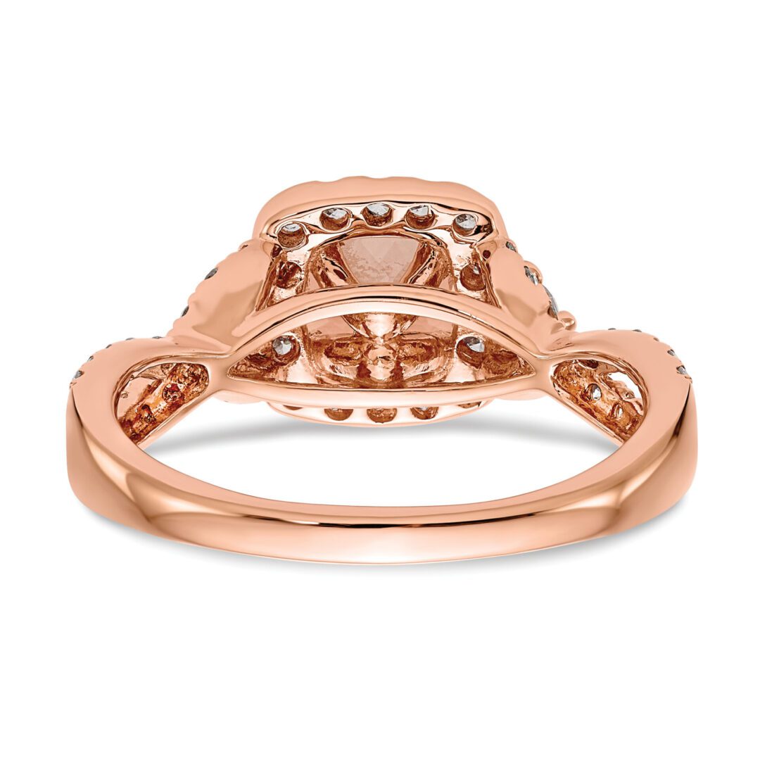 Rose gold ring with an intricate setting and delicate design.