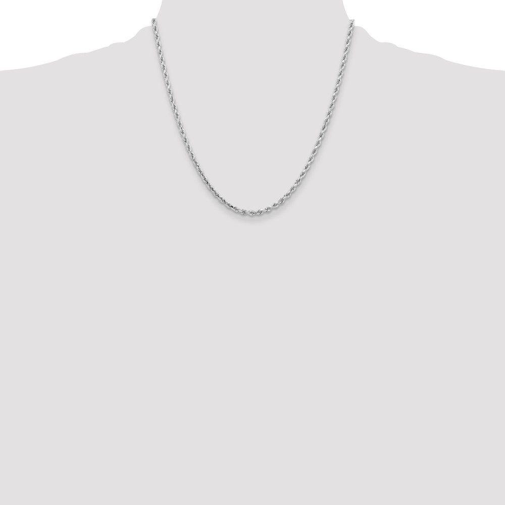 A simple silver chain necklace on a plain background.