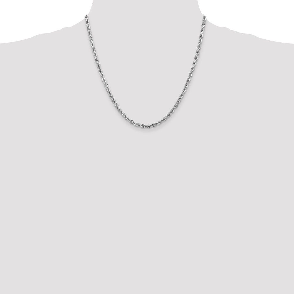 Simple silver chain necklace on a display bust.