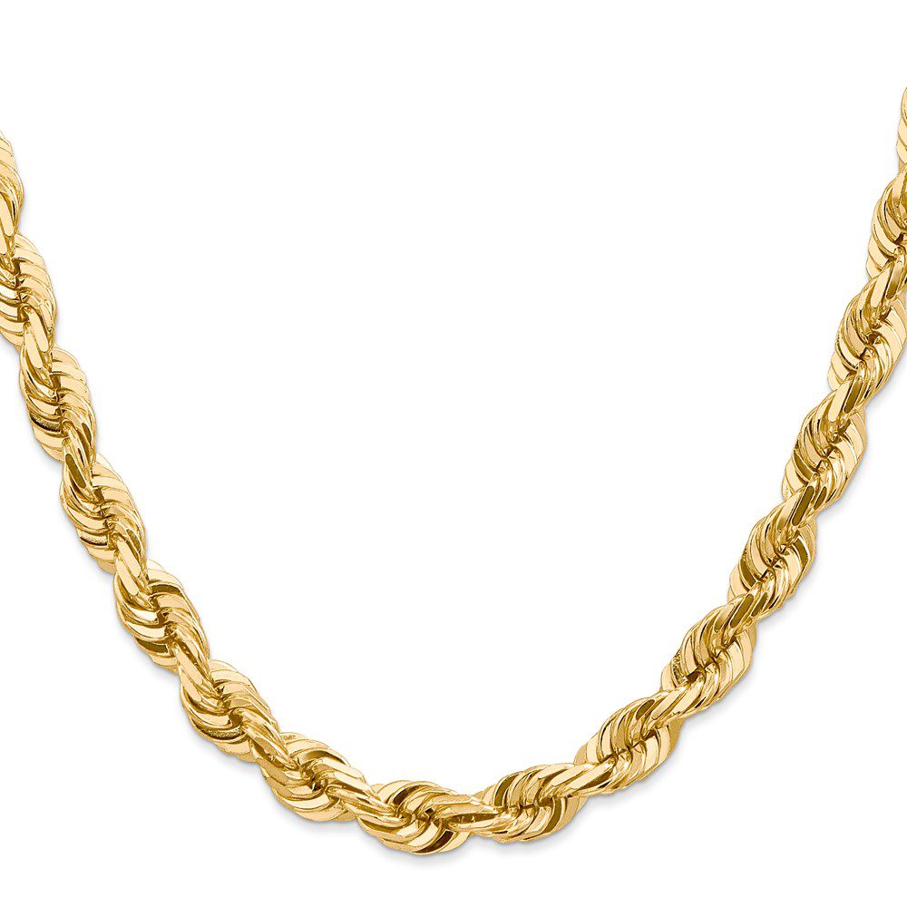 A close-up of a twisted gold chain necklace.