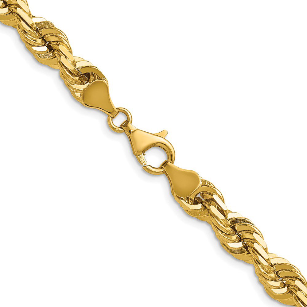 Close-up of a gold chain bracelet with intricate links.