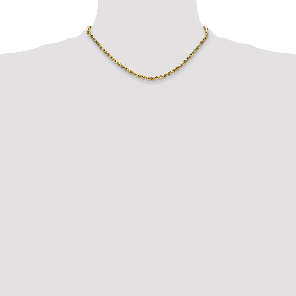 Elegant gold chain necklace displayed on a white bust.