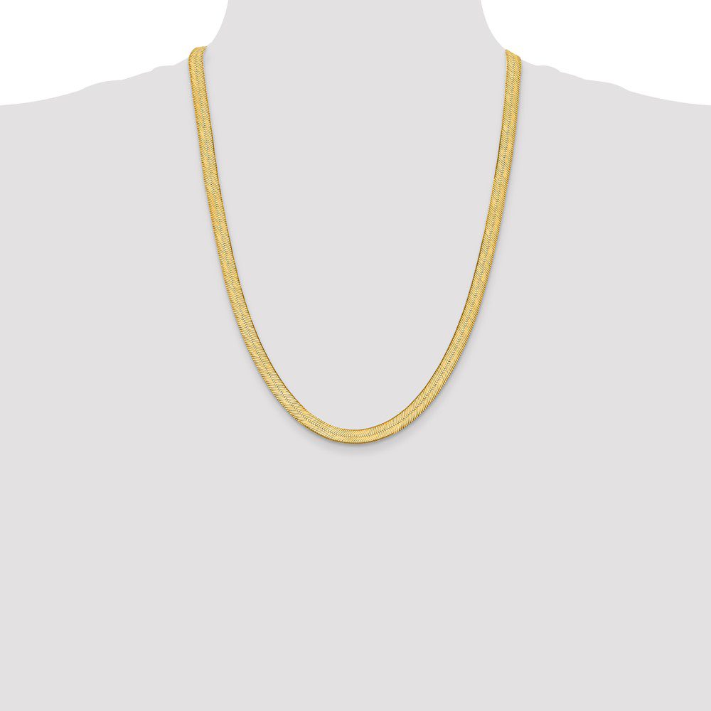 Simple gold chain necklace displayed on a plain background.