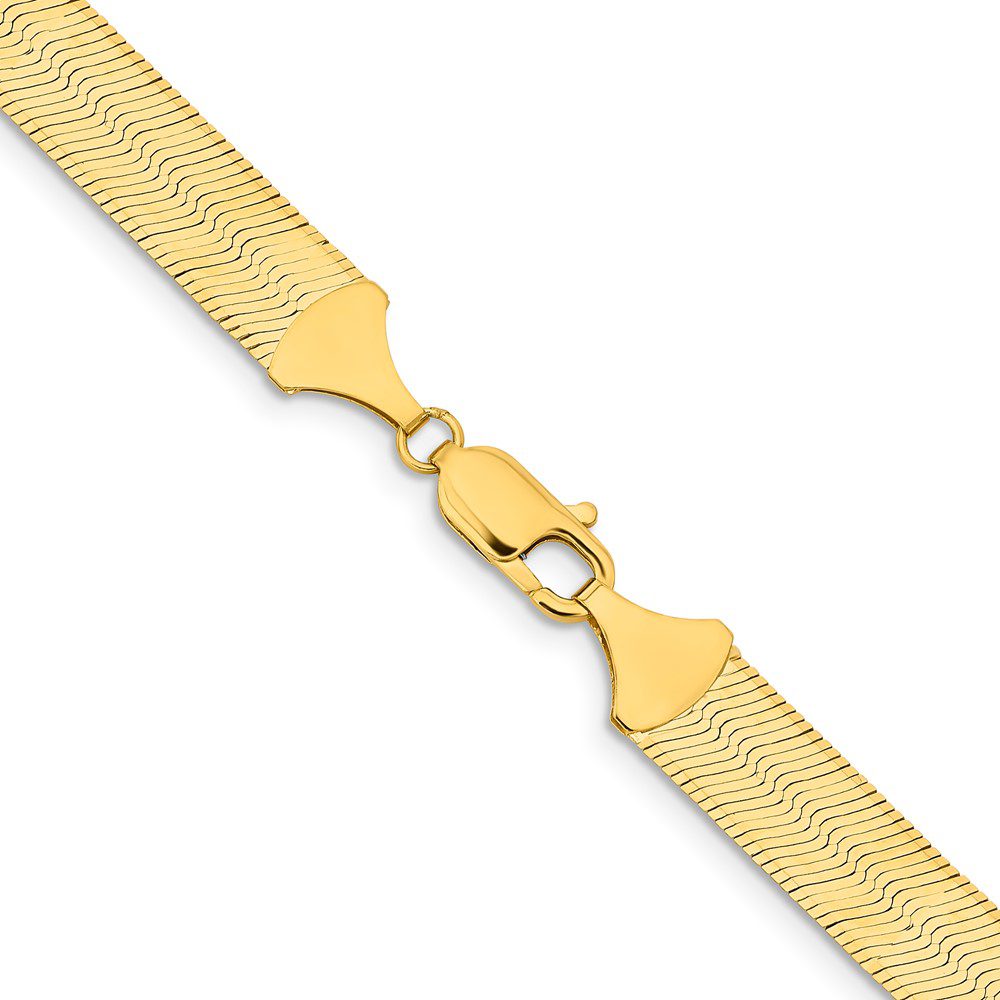 Gold mesh bracelet with a unique clasp.