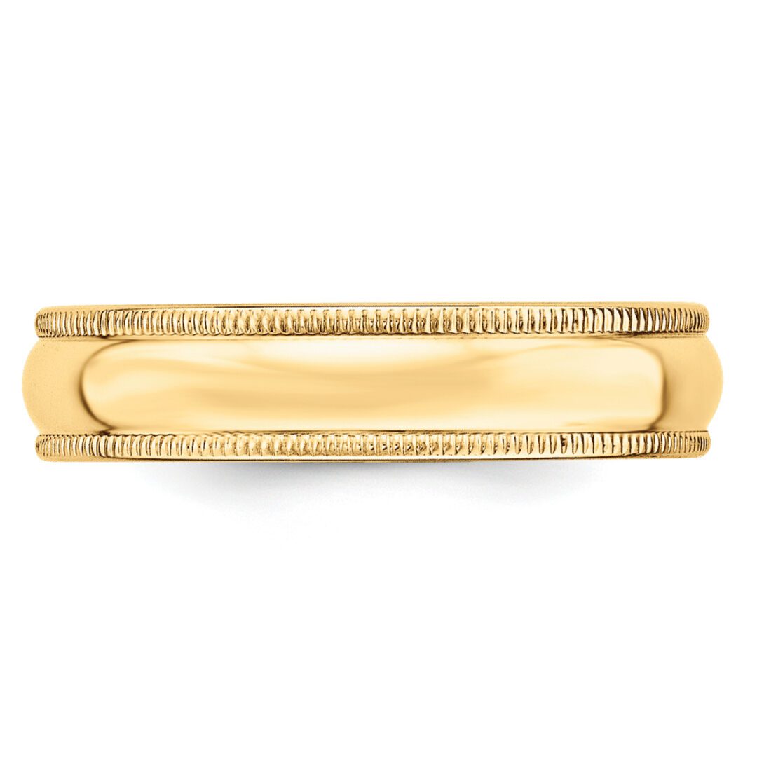 Elegant gold wedding band with intricate detailing.
