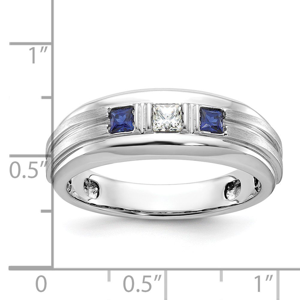 Elegant silver ring with blue and white square gemstones.