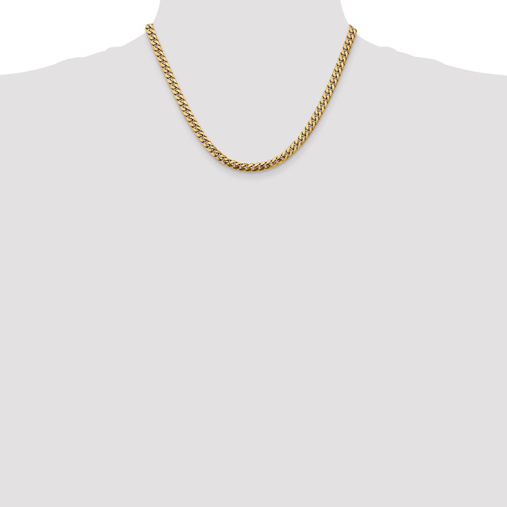 Elegant gold chain necklace on a plain background.