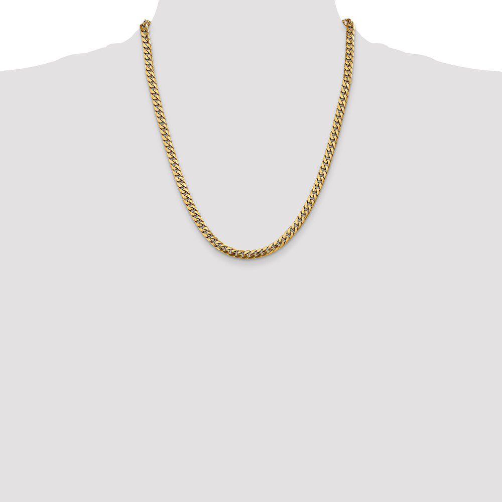 Simple gold chain necklace on a gray background.