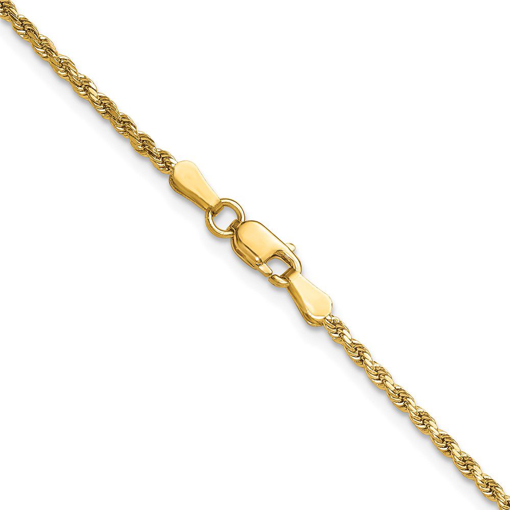 Close-up of a gold chain necklace with a lobster clasp.