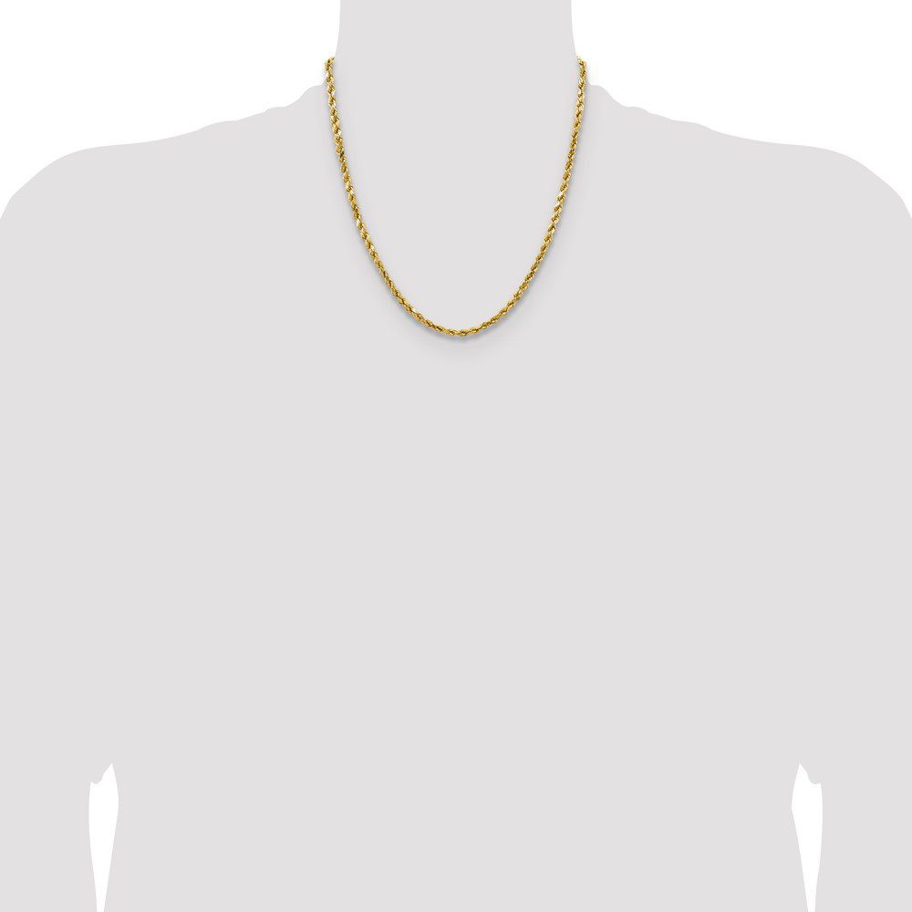 A simple gold chain necklace on a gray silhouette.