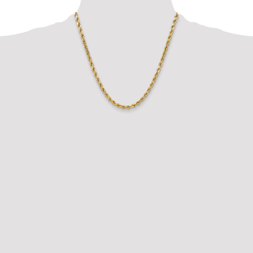Elegant gold chain necklace on a plain background.