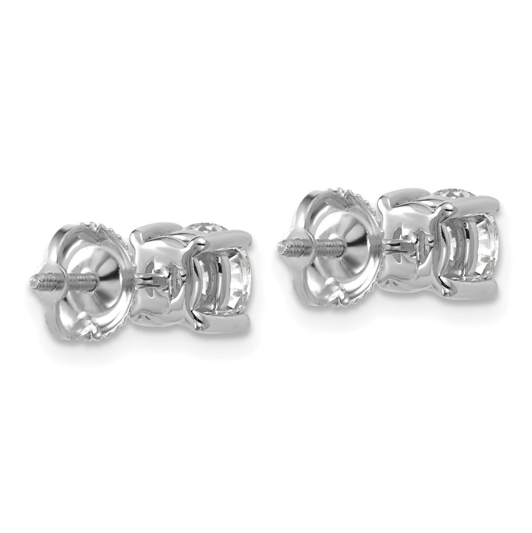 Pair of silver stud earrings with butterfly backs.