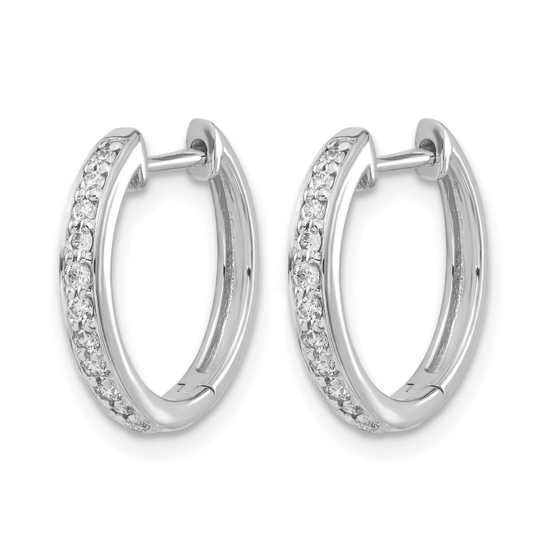 Elegant silver hoop earrings adorned with small sparkling stones.