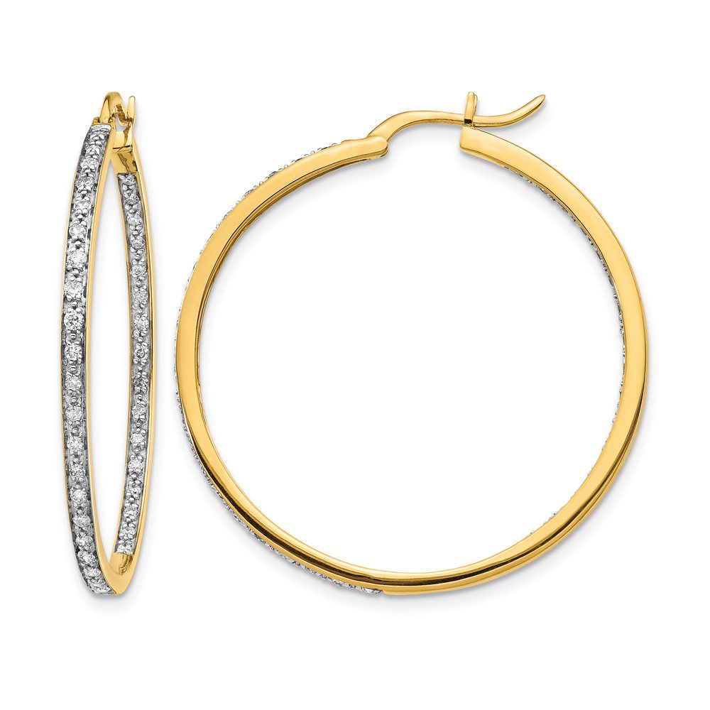 Elegant gold hoop earrings, one adorned with sparkling diamonds.