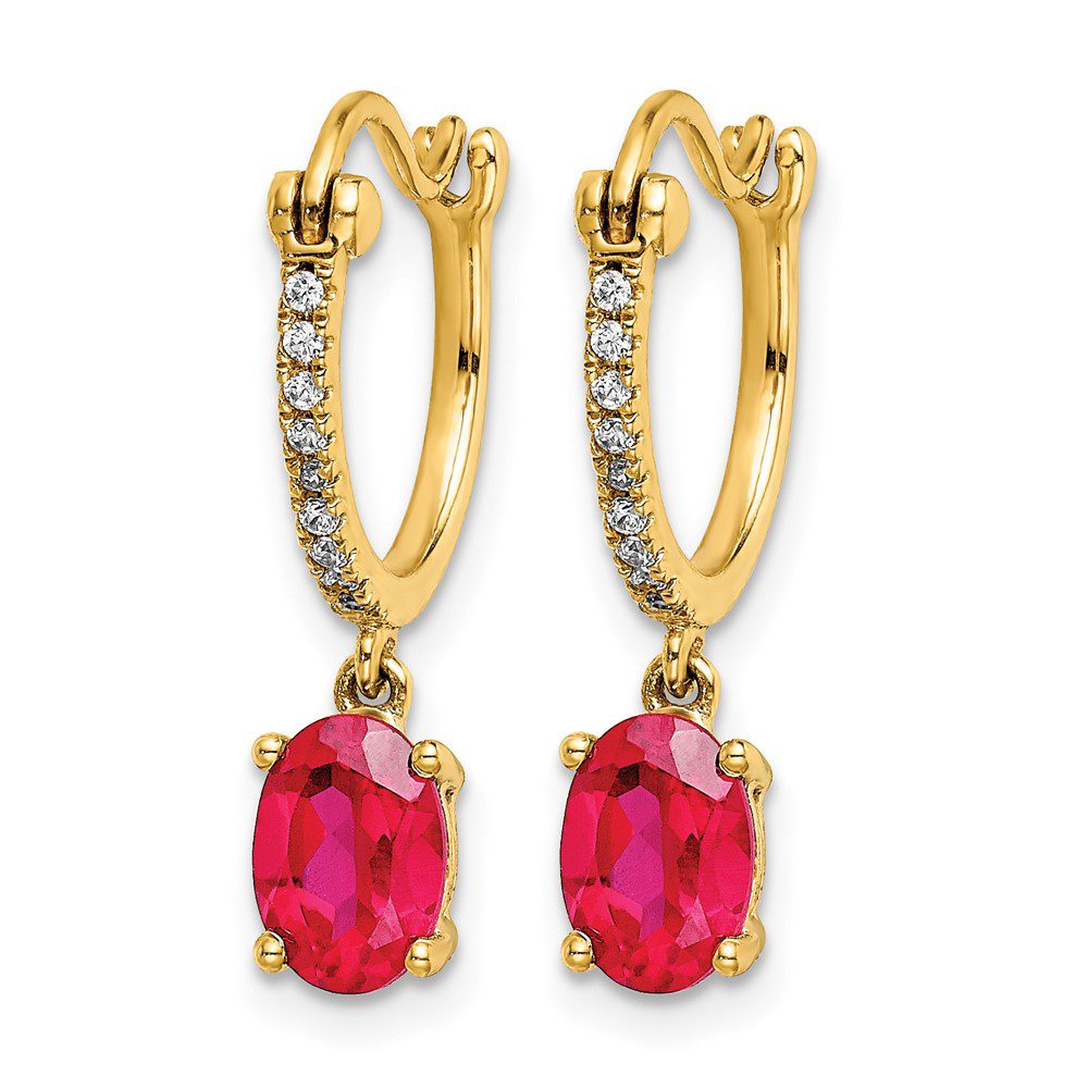 Elegant gold earrings with oval red gemstones and diamond accents.