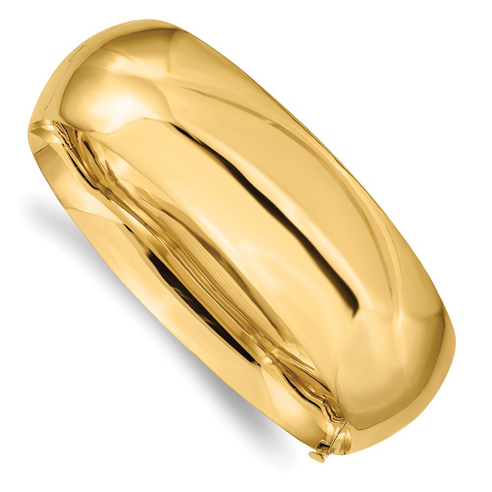 A shiny gold metallic balloon shaped like a pill.