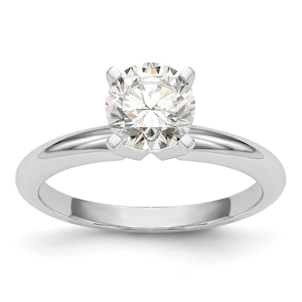 Elegant solitaire diamond engagement ring with a polished silver band.