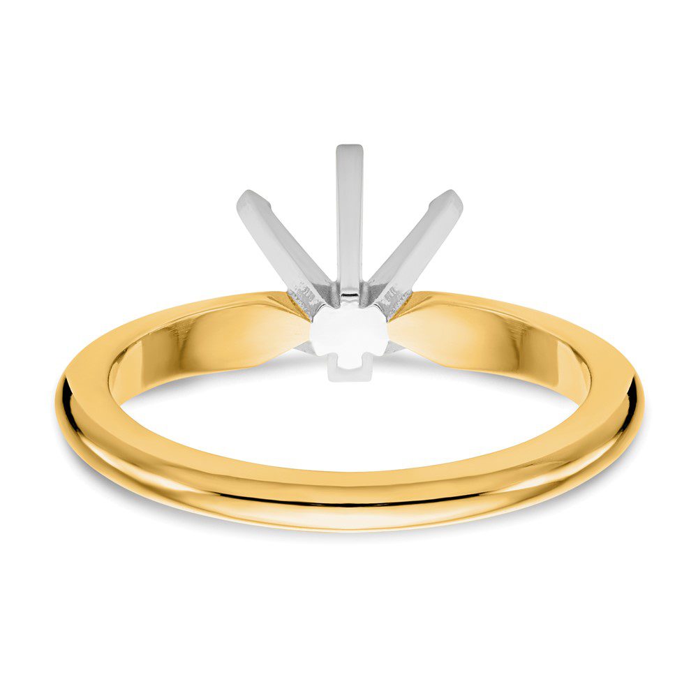 Elegant gold ring with a classic solitaire setting.