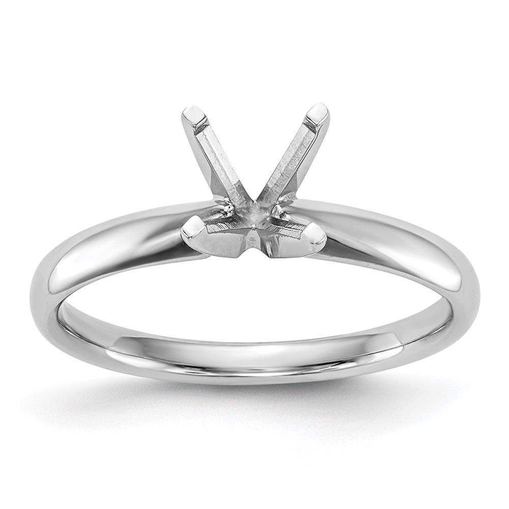 A simple silver ring with a four-prong setting.