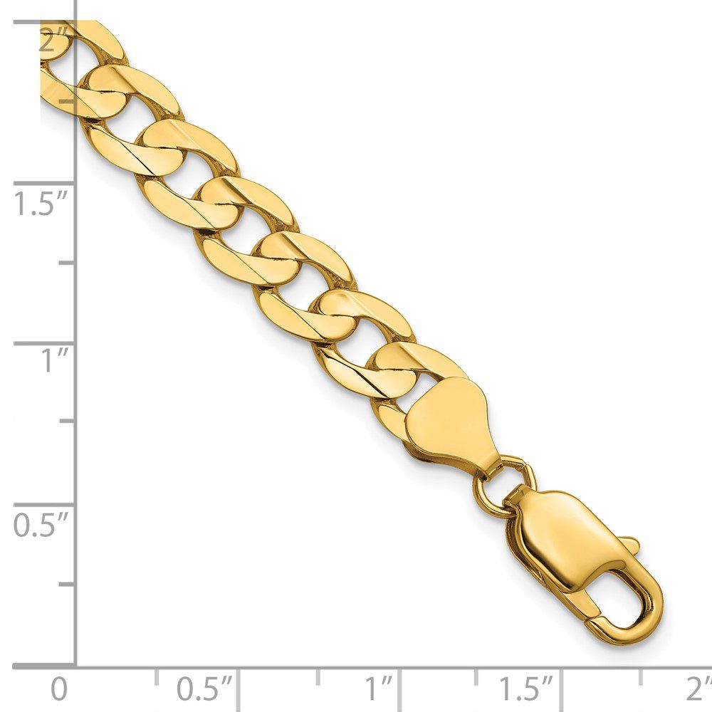 Gold chain bracelet with clasp and ruler for size reference.