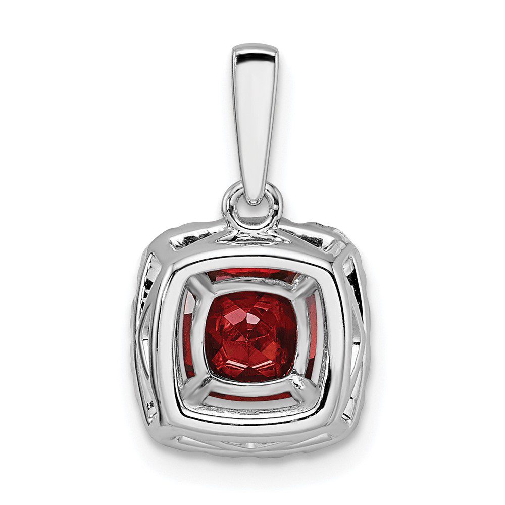 Elegant silver pendant with a deep red gemstone centerpiece.