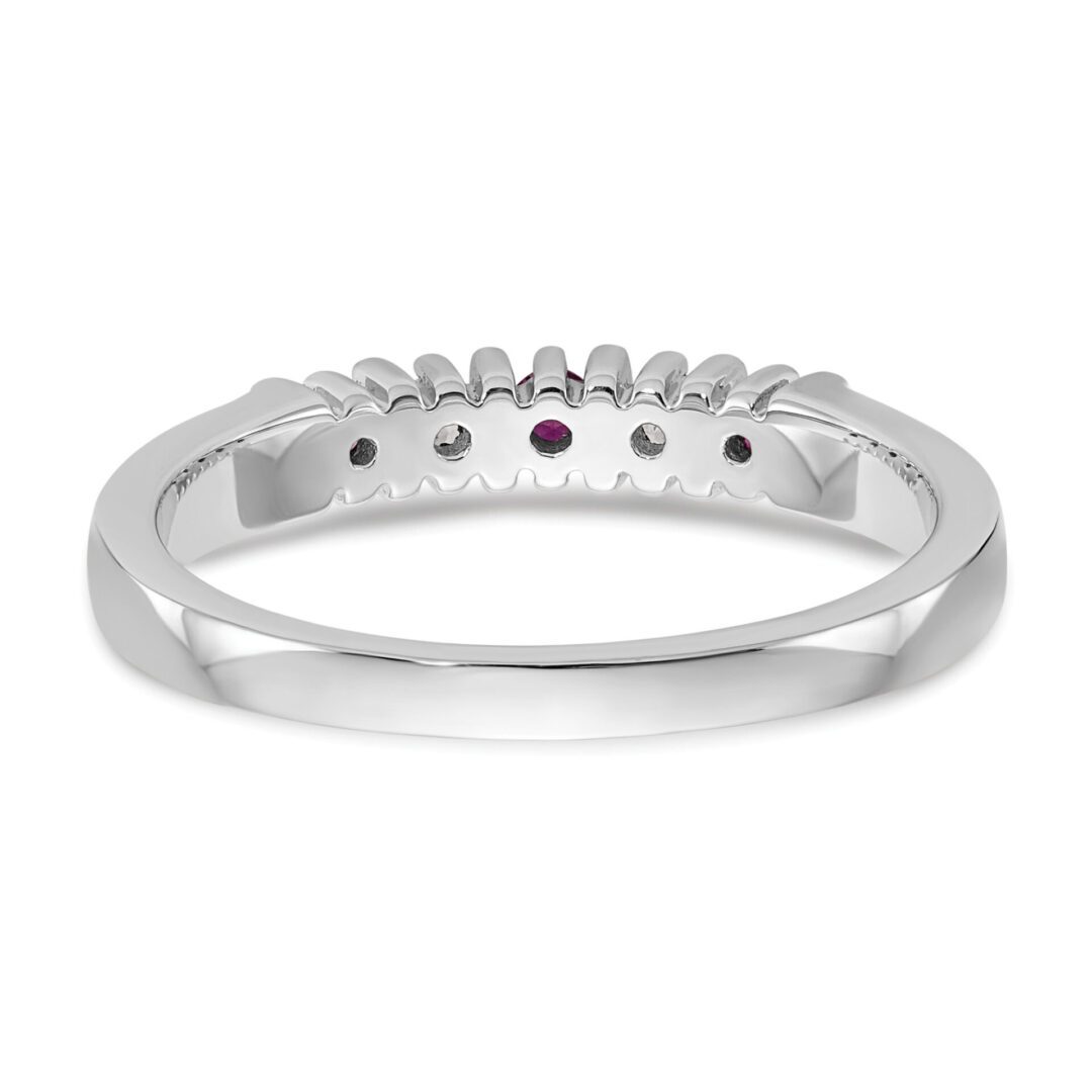 Elegant silver ring with small embedded gemstones.