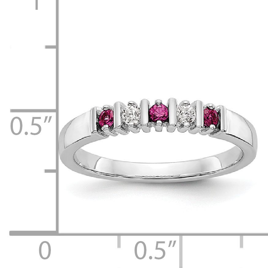 Elegant silver ring with red and white gemstones.