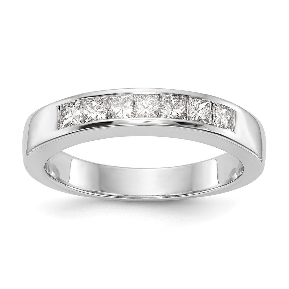 Elegant silver ring with embedded square-cut diamonds.