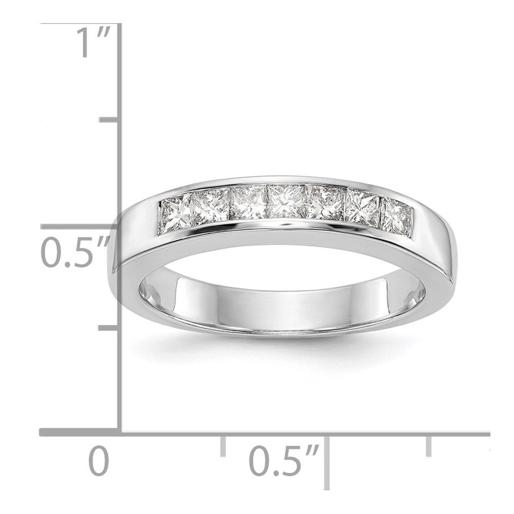 Silver ring with embedded diamonds shown on measurement scale.