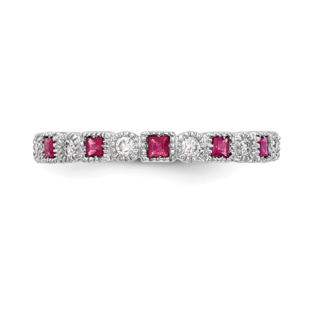 Elegant bar pin with alternating rubies and diamonds.