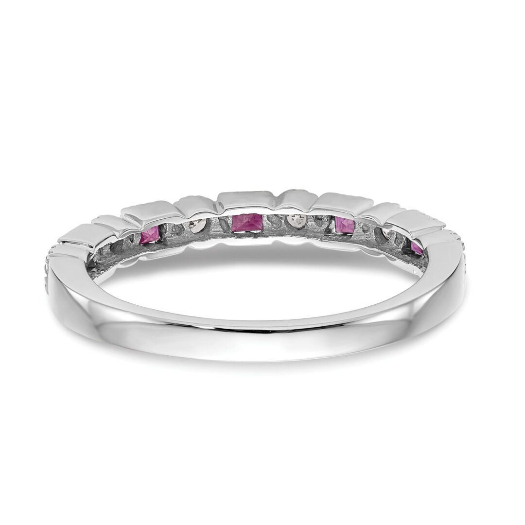 Elegant silver ring with alternating pink and clear gemstones.