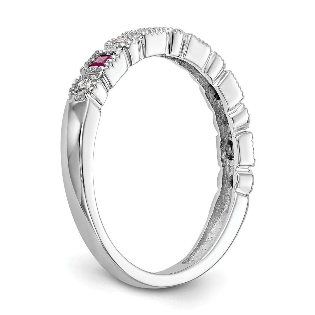 Elegant silver ring with a small diamond accent.