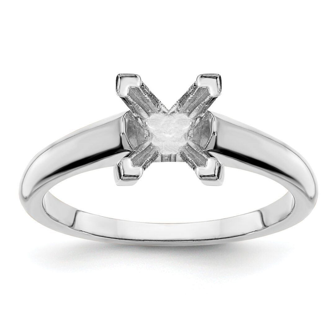 Elegant silver ring with a clear princess-cut gemstone.