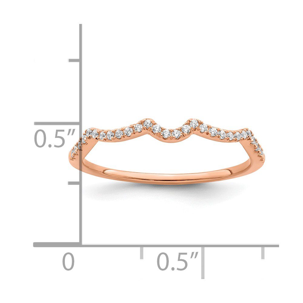 Delicate rose gold ring with small diamonds in a wave pattern.
