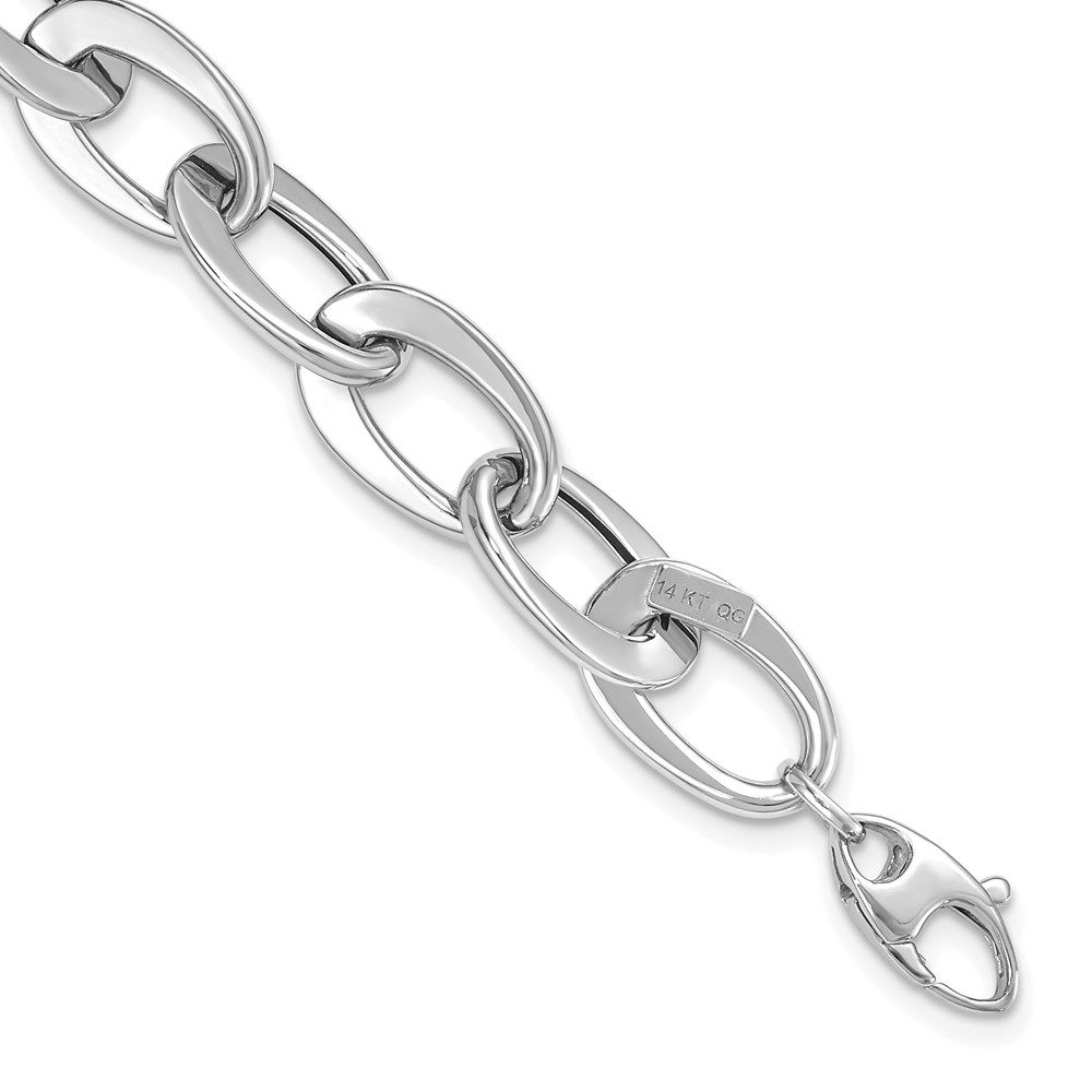 Close-up of a silver chain bracelet with a lobster clasp.