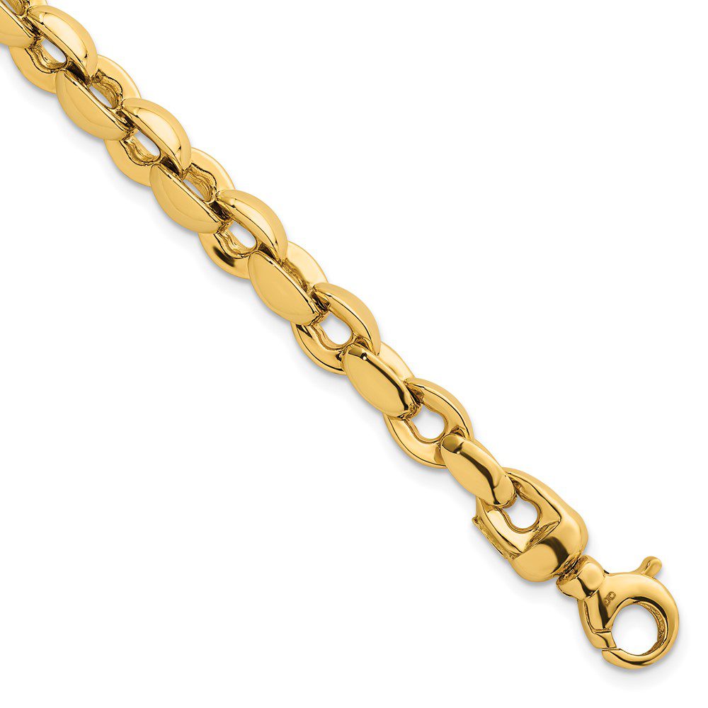 Close-up of a gold chain necklace with a lobster clasp.