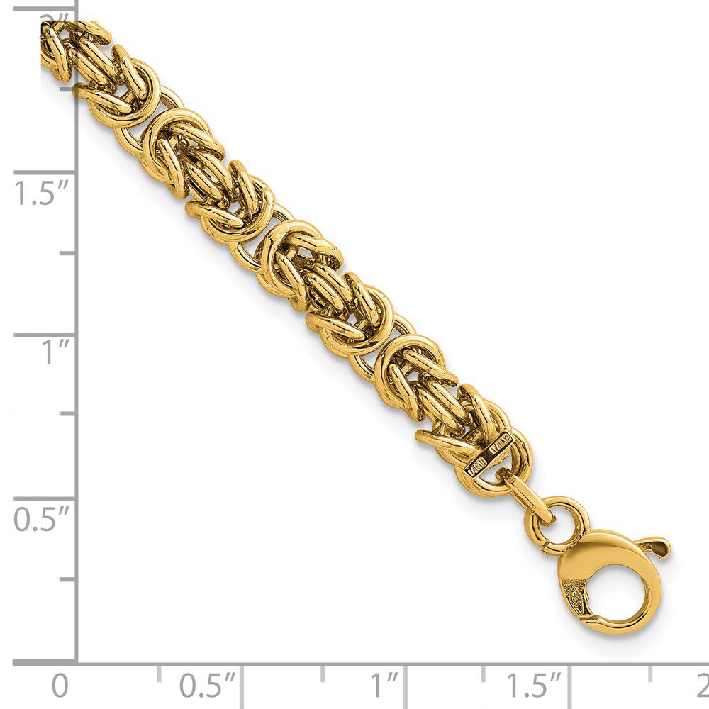 Gold-toned chain bracelet with intricate links and lobster clasp.