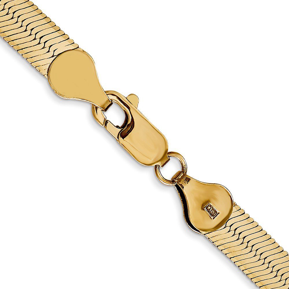 Close-up of a gold bracelet clasp.