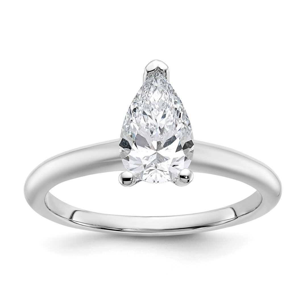 Elegant pear-shaped diamond solitaire ring with a sleek silver band.