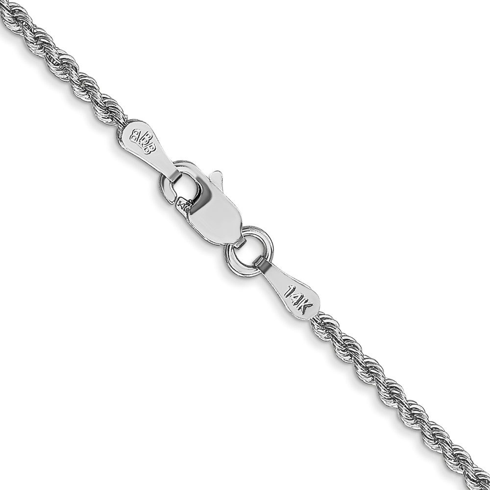 Close-up of a silver bracelet chain with a heart-shaped clasp.