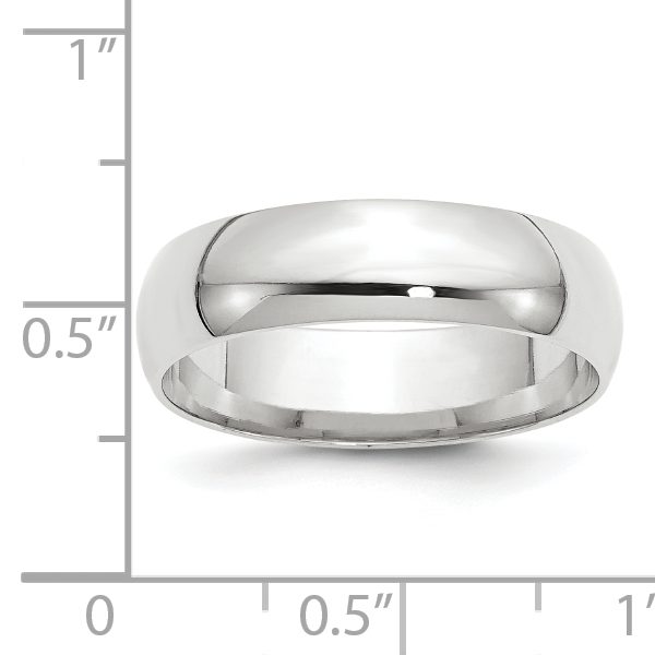 A polished silver wedding band against a white background.