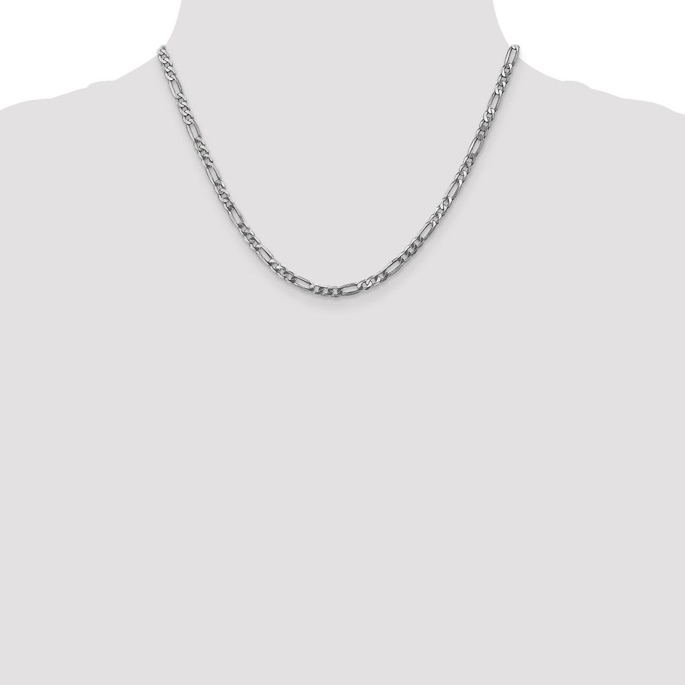 Simple silver chain necklace on a gray background.