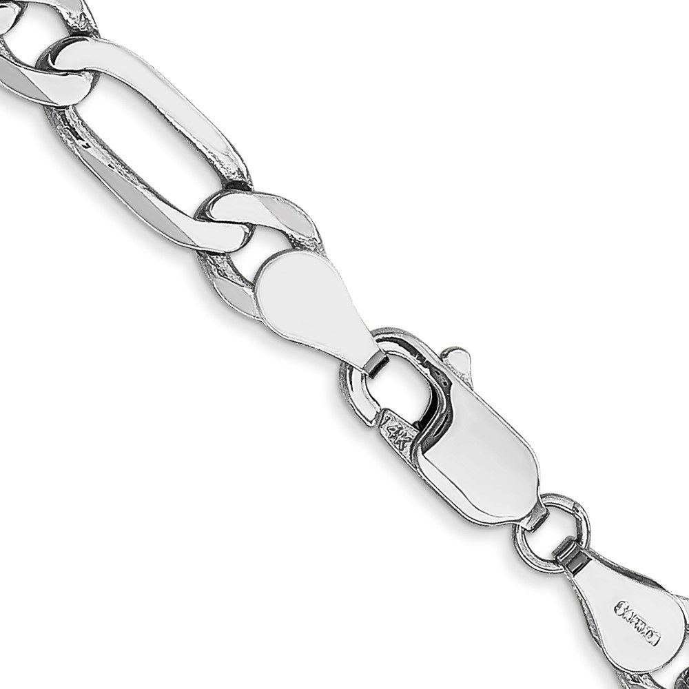 Close-up of a silver chain bracelet with a heart-shaped link and a clasp.