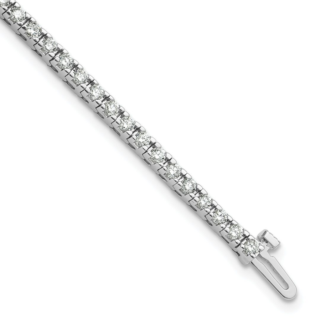Elegant silver bracelet with a small cross pendant.