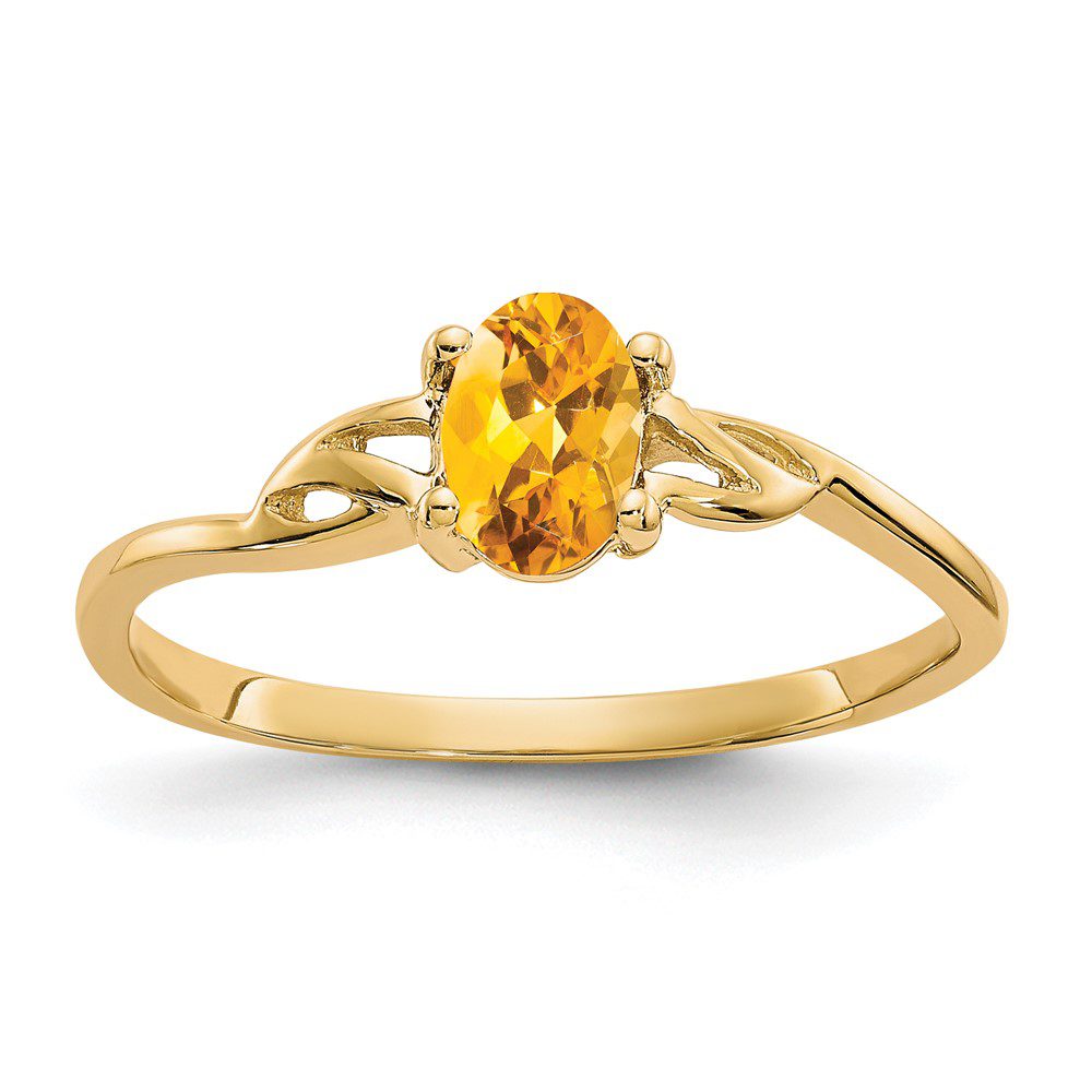 Elegant gold ring with a bright yellow oval gemstone.