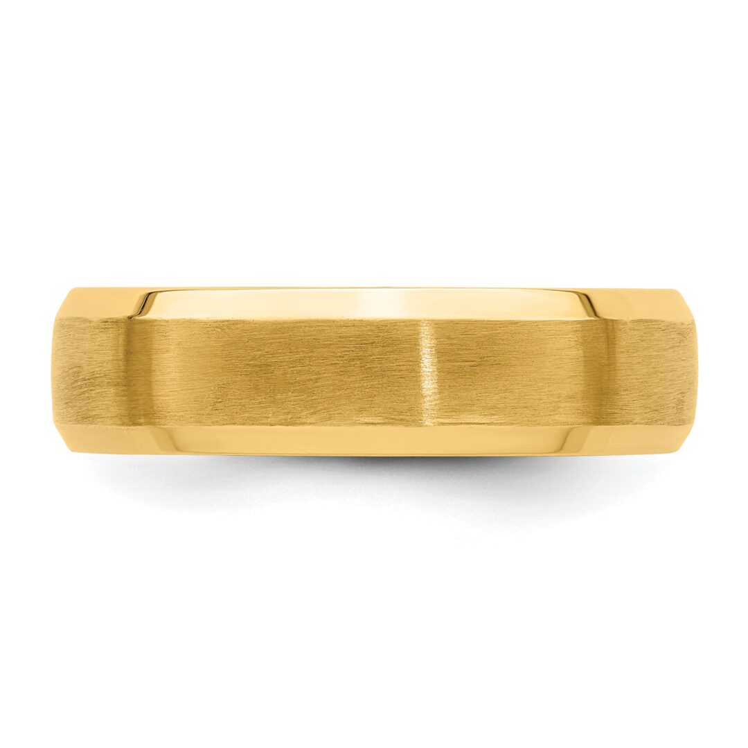 A simple gold band ring with a smooth, polished finish.